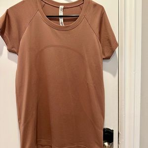 Lululemon Swiftly tech short sleeve top. Size 12. Brier Rose color